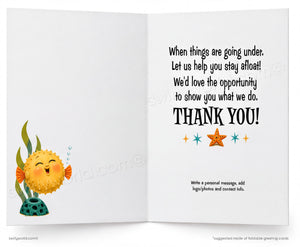 An open folding greeting card shown front and back. The left panel features a smiling yellow pufferfish underwater with green and orange seaweed, and the right panel has a black 'THANK YOU!' message with small starfish illustrations.