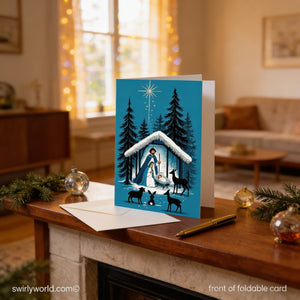 A blue greeting card depicting a nativity scene with a woman, baby Jesus, and animals is displayed on a wooden surface, surrounded by holiday decorations and ornaments.