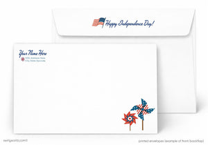 The image is a printed envelope featuring a patriotic design with a windmill and an American flag. The envelope is labeled as a "Happy Independence Day!" envelope, and it has a blank space for a recipient's name and address.