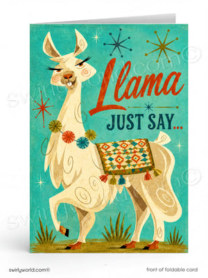 A folded greeting card featuring a stylized cream llama with a colorful geometric saddle blanket against a turquoise background, with the words 'Llama JUST SAY.