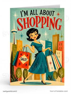 A retro-style foldable greeting card featuring a woman in a teal dress holding shopping bags, with the text 'I'M ALL ABOUT SHOPPING' on a mint background and cityscape illustration.