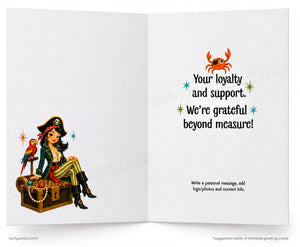 An open greeting card with a white background, featuring a pirate illustration on the left panel and printed text on the right panel including an orange crab and the phrase 'Your loyalty and support. We're grateful beyond measure!'.