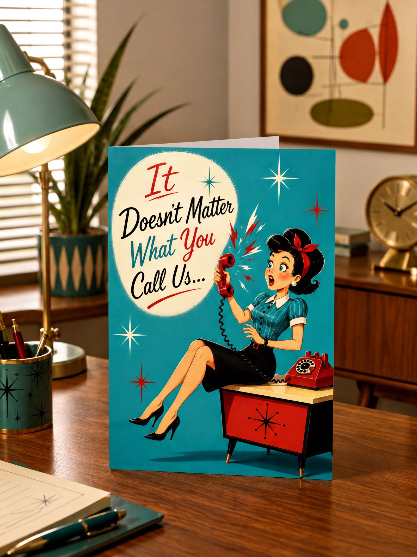 A retro-style foldable greeting card featuring a vintage illustration of a woman sitting at a red rotary phone on a desk against a teal background. Large text on the card reads, 'It Doesn't Matter What You Call Us.