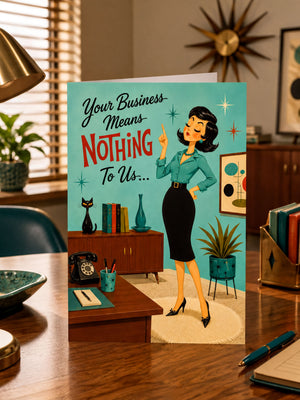 A retro-style greeting card displayed on a wooden desk in a mid-century modern office setting. The card features a vintage illustration of a woman in a teal blouse and black skirt, with the text 'Your Business Means Nothing To Us.
