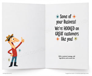 An open greeting card shown front and back. The left panel features a cartoon man in a cowboy hat giving a thumbs-up, and the right panel contains printed text that reads, 'Some of your Business! We're HOOKED on GREAT customers like you!' with small decorative starburst icons.