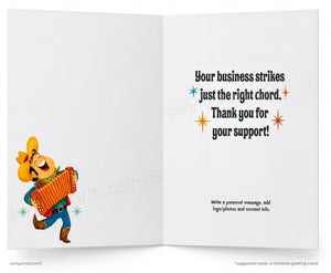 An open greeting card template with a white background. The left panel shows a cartoon cowboy playing an accordion, while the right panel contains placeholder text reading 'Your business strikes just the right chord.