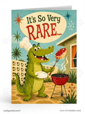 The image is a colorful illustration of a green alligator wearing a chef's hat and holding a plate, standing next to a red grill with a steak on it. The text "It's So Very Rare..." is displayed above the alligator, and the image is described as a "front of foldable card" with a "swirlworld.com" watermark.