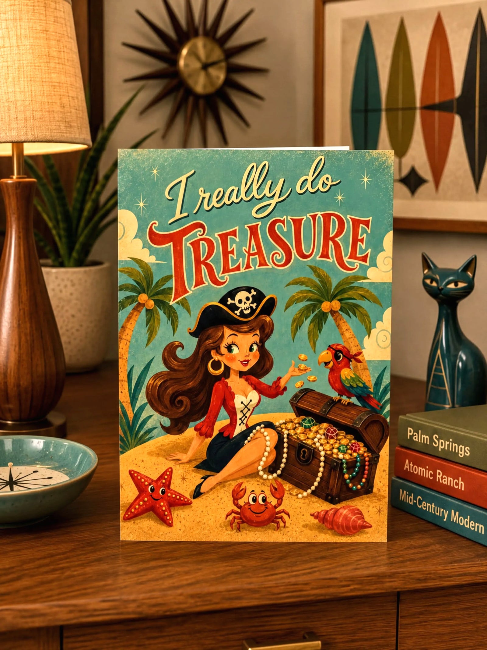 A foldable greeting card featuring a retro pirate illustration with the text 'I really do TREASURE' on a sandy beach scene with palm trees, a treasure chest, pearls, and a parrot.