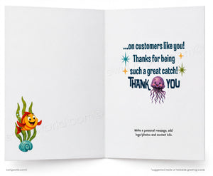 An open greeting card shown front and back on a white background. The front features a cartoon orange fish with red fins and green seaweed on a blue shell.