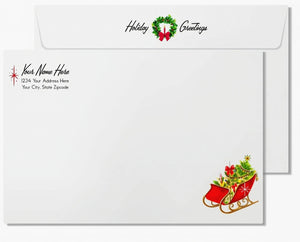 a holiday greeting card with a Christmas wreath and a red sleigh with a Christmas tree on it. The card has a white background with text and a magnifying glass icon.