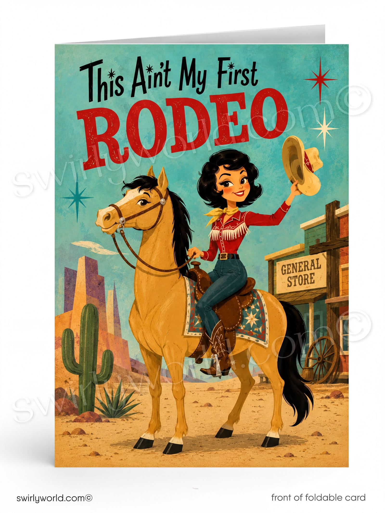 A folded greeting card shown upright on a white background. The front features retro western artwork with the text 'This Ain't My First RODEO' above an illustrated woman riding a tan horse in a desert town scene.
