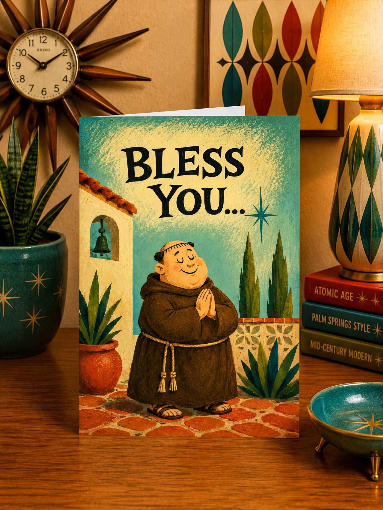 The image is a greeting card featuring a cartoon illustration of a smiling man in a brown robe, standing in front of a building with a bell tower. The card has a blue background with a white border, and the text "Bless You..." is displayed prominently above the illustration.
