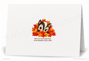A white folded greeting card shown standing open against a white background. The back side features a cute cartoon chipmunk peeking out from orange and red autumn leaves, with placeholder text below reading 'Add more text/images/logo to the backside of your cards.