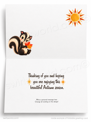 Foldable greeting card shown open, with a cartoon squirrel holding an autumn leaf on the left and a sun illustration on the upper right. The lower panel contains a message about enjoying the beautiful autumn season, with editable placeholder text below.