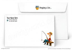 Custom printed white envelopes shown on a light gray background, with one envelope open behind another. The front envelope features a cartoon fisherman sitting on a bench and the text 'Dropping a Line.