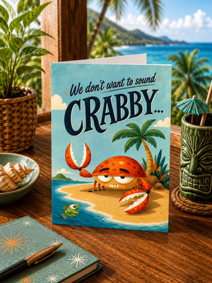 a greeting card with a cartoon crab on a beach scene, surrounded by tropical elements such as palm trees and a tiki mask.