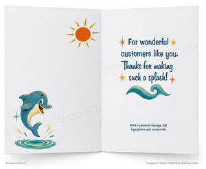 An open greeting card template with a white background, featuring a cartoon dolphin jumping on the left page and a sun illustration near the top. The right page has a blue handwritten-style message reading 'For wonderful customers like you.