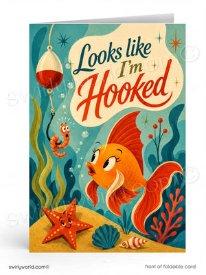 Card with a fish and worm character underwater, text 'Looks like I'm Hooked', colorful design