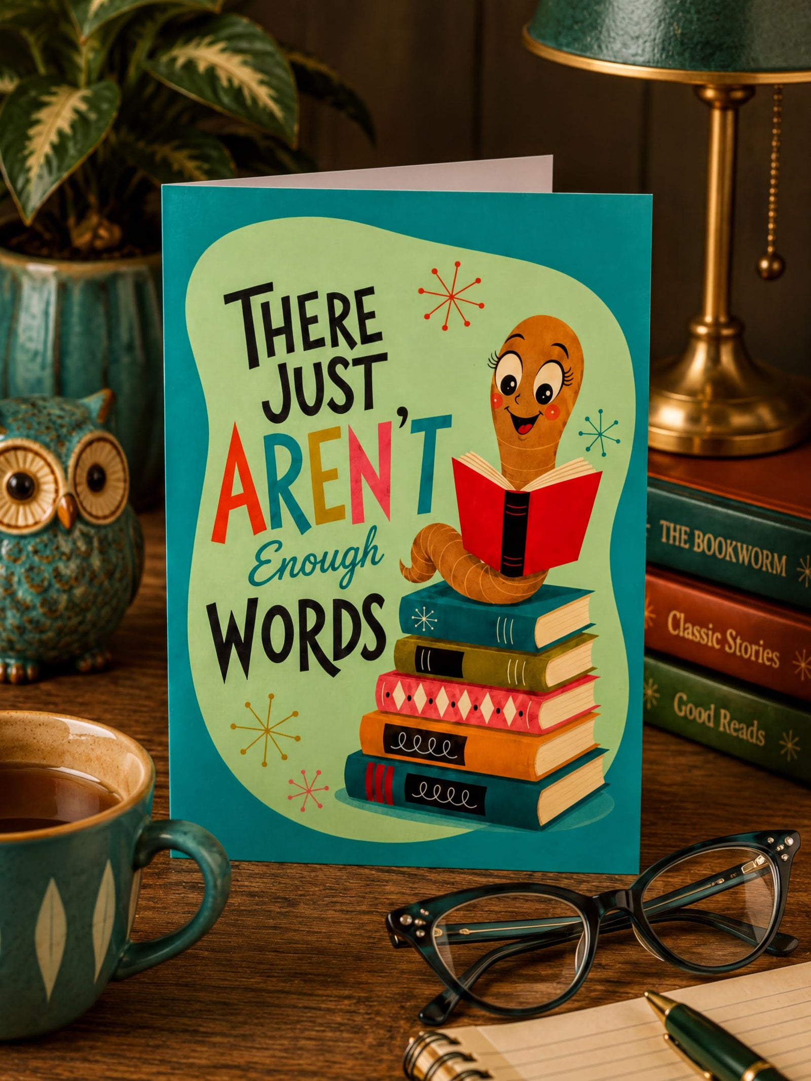 Card with a cartoon character reading a book and text 'There just aren't enough words' on a teal background.
