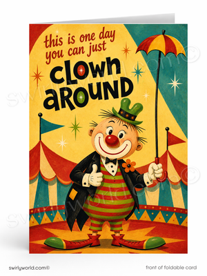 A folded greeting card shown standing upright, featuring a colorful retro circus illustration with a clown, striped red-and-yellow outfit, red-and-yellow umbrella, and the text 'this is one day you can just clown around'.