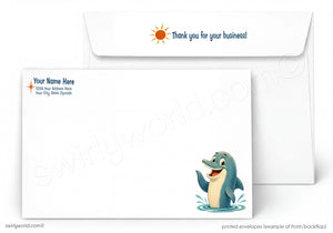 A printed white envelope set shown on a light gray background. The front envelope has a cartoon dolphin illustration at the lower right and placeholder text on the upper left.