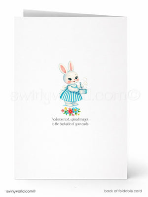 A white greeting card with a cartoon illustration of a bunny wearing a blue and white striped dress, holding a teapot and flowers. The card has a message encouraging the addition of more text or images to customize the card.