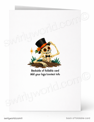 A folded white greeting card shown front and back on a white background. The front features a cartoon skeleton wearing a black top hat and bow tie, with small plants and a star accent.