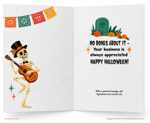 An open greeting card design with a Day of the Dead theme. The left page shows a cartoon skeleton playing an orange guitar under a colorful papel picado banner.