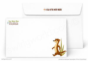 A printed white stationery set showing the front and back of a note envelope with an envelope behind it. The front has a cartoon lion cub illustration near the lower right and small placeholder address text in the upper left.