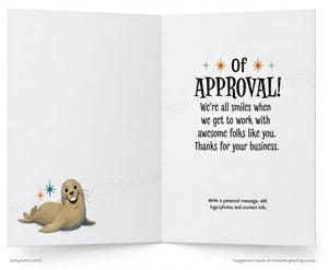 Open card with a cartoon seal and text on a white background