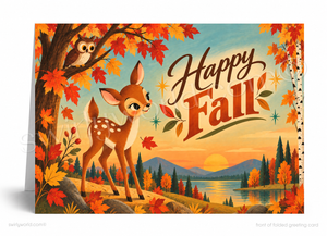 A folded greeting card shown standing upright, featuring a retro-style autumn illustration with a deer, owl, lake, mountains, and the words “Happy Fall” in large decorative lettering.