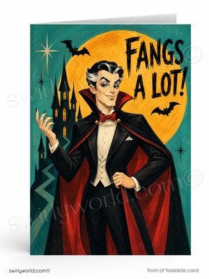 A folded greeting card shown front-on against a white background. The card features an illustrated vampire in a black and red cape with the text 'Fangs a lot!' over a large yellow moon, bats, stars, and a castle.