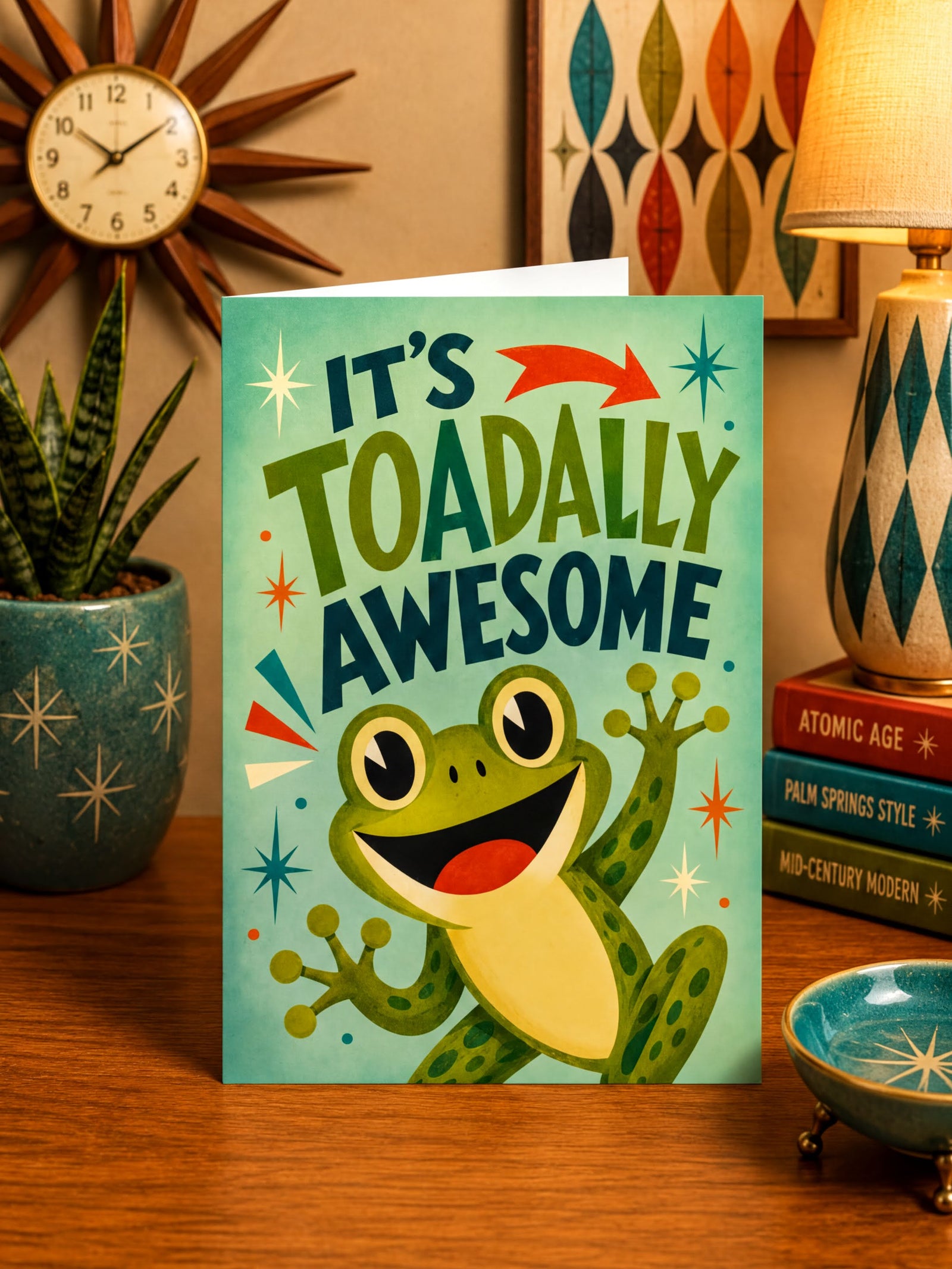 Greeting card with a frog illustration and text 'It's Toadally Awesome' on a green background.