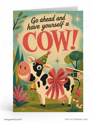 A folded greeting card shown front-on with a colorful retro illustration of a cow wearing a party hat and large red bow, with the text 'Go ahead and have yourself a COW!'.