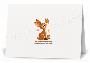 A folded white greeting card shown standing open against a white background. The front is blank, while the back features a small illustration of a brown rabbit with a butterfly, orange leaves, and placeholder text that reads 'Add more text/images/logo to the backside of your cards.