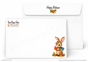 A set of white printed envelopes shown on a light gray background. The front envelope displays a cute cartoon autumn bunny holding orange leaves, and the back envelope has 'Happy Autumn' printed with a small sunflower.