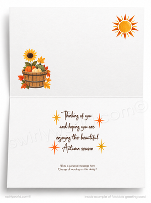 Inside view of a foldable autumn-themed greeting card on a white background. The card features a sunflower and fall leaves basket illustration on the upper left, an orange sun in the upper right, and a handwritten-style autumn message in the center with placeholder writing instructions at the bottom.