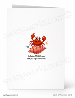 A folded white card shown front and back on a white background. The front features a cartoon red-orange crab sitting on a pink shell with small star accents.