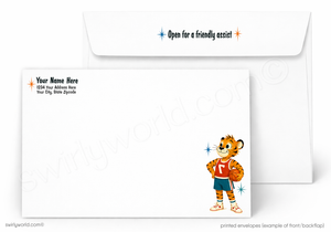 A set of white printed envelopes shown on a light gray background. The front envelope displays a cartoon tiger mascot wearing a red and orange basketball jersey, while the back envelope shows placeholder text for personalization and a blue and orange 'Open for a friendly assist' print.