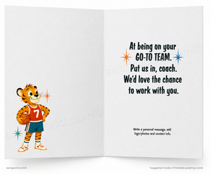 An open greeting card with a white interior. The left page shows a cartoon tiger mascot in a basketball uniform holding a basketball.