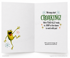 An open greeting card with a white background, featuring a cartoon green frog jumping on the left page and playful croaking-themed text on the right page.