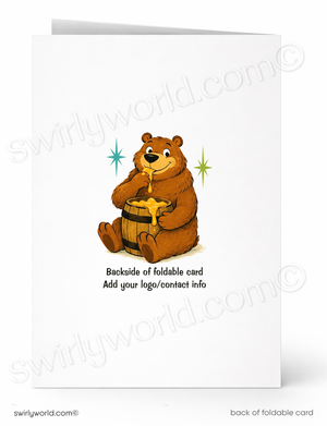 A folded white greeting card shown front and back. The front features a cartoon brown bear holding a honey pot with gold honey dripping out, plus small blue and green sparkle graphics.