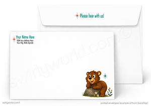 Personalized white printed envelopes shown on a light gray background, with one envelope in front featuring a cartoon brown bear sitting on a rock and the text 'Please bear with us!' in teal, and the back envelope showing placeholder address text and a small star icon.