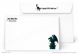 Custom printed white envelopes shown on a light gray background. The front envelope features a black gargoyle illustration with small orange and blue star accents, and the back envelope shows a black cat silhouette with the text 'A spooky little thank-you' in blue and orange.