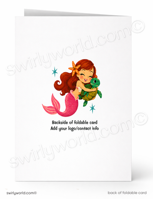 A folded greeting card shown front and back on a white background. The front features a cartoon mermaid with red hair and a pink tail hugging a green sea turtle, with small blue star accents.