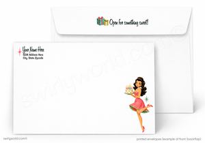 A printed stationery set showing a white envelope with a festive holiday message and a matching white card featuring a retro pin-up girl illustration and placeholder text.