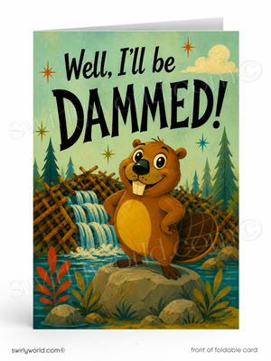 A folded greeting card shown front-facing on a white background. The card features a cartoon beaver standing on a rock by a waterfall and river, with the text 'Well, I'll be DAMMED!' in large black letters.