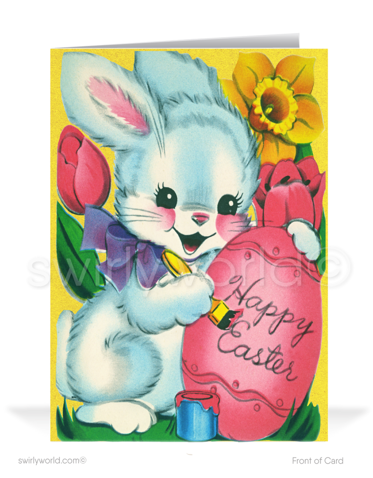 Charming vintage Easter card with a bunny in a purple bow writing on a pink egg. Bright yellow 1950s floral backdrop with tulips, lilies & retro flair!