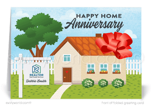 Cute house with big red bow tied around it; happy home anniversary greeting card marketing for Realtors®.