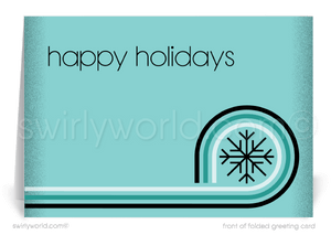 Swirly World offers a stylish "Happy Holidays" card in cool blue, featuring mid-century modern graphics with bold snowflakes and a geometric swirl for a chic holiday touch.